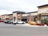 Exterior of multiple buildings and parking area at Sandcreek Commons