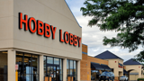 Exterior of front of Hobby Lobby building at dusk