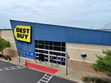 Exterior view of Best Buy building and parking area apart of Central Texas Marketplace