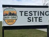 Exterior photo of Crush the Curve COVID-19 sign offering antibody testing in Idaho Falls