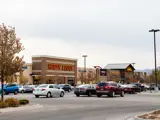 Exterior of front of Hobby Lobby building and parking area at Sandcreek Commons
